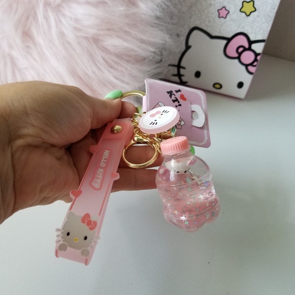 Hello Kitty Key Chain Floating  Oil Liquid Acrylic Bottle Key Chain New